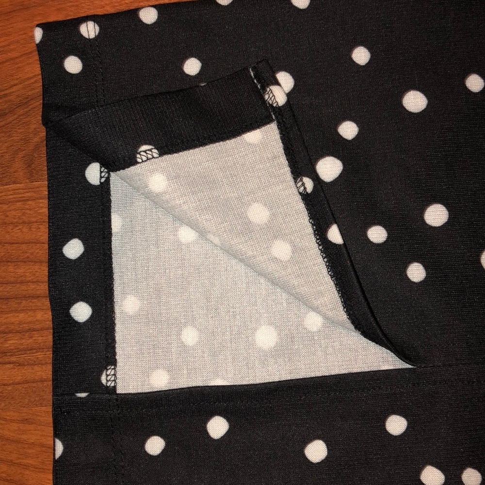 Black dress with white polka dots.